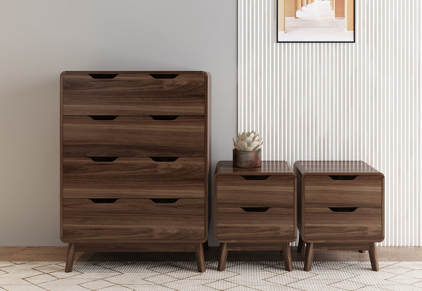 Wooden dresser and nightstands against a neutral wall with a small plant on one of the nightstands.